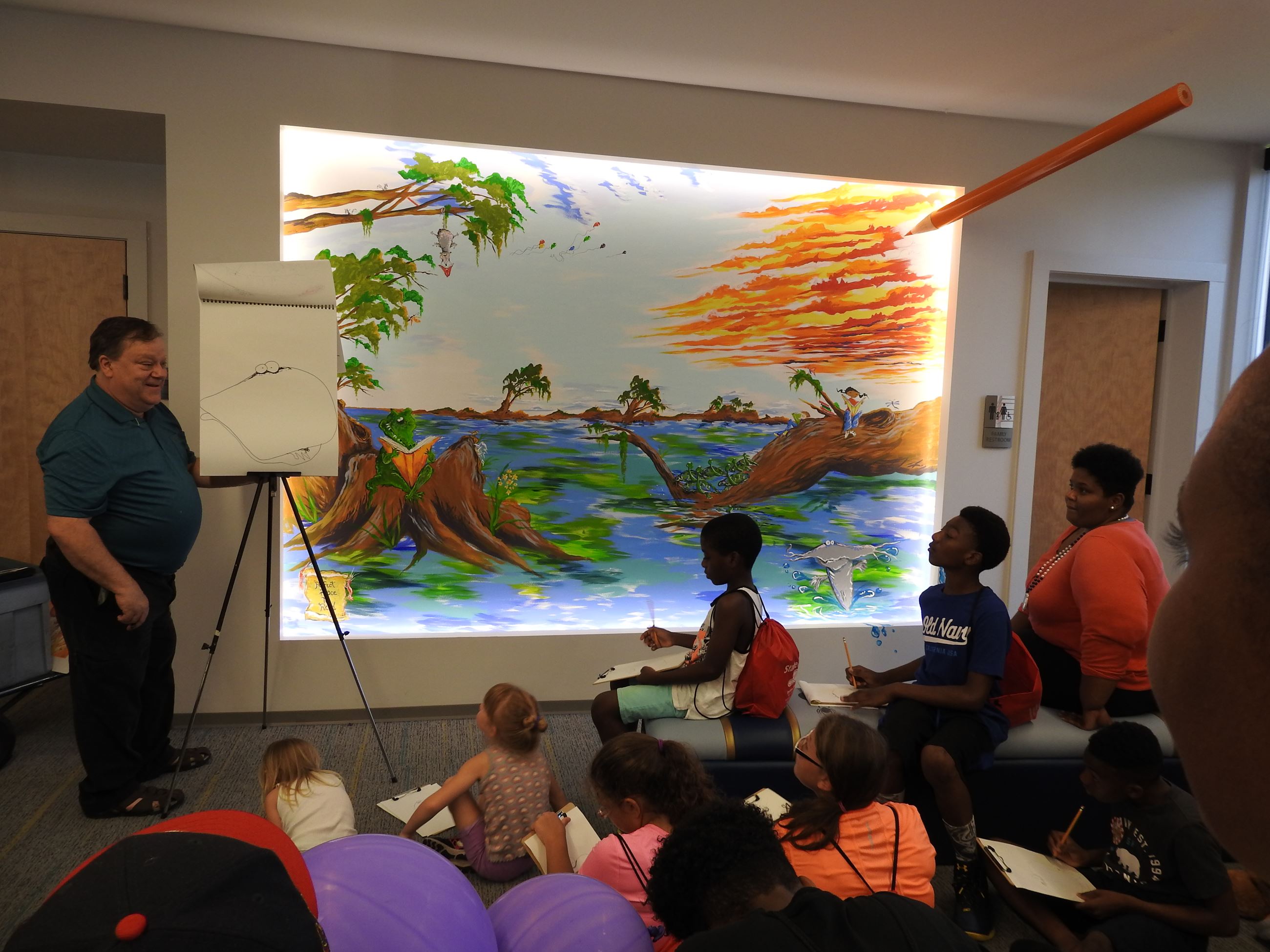 Artist showing his work to the children